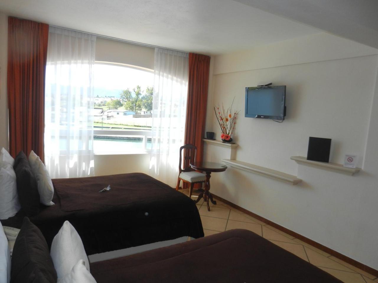 Hotel 9 Manantiales Чигнауапан Екстериор снимка