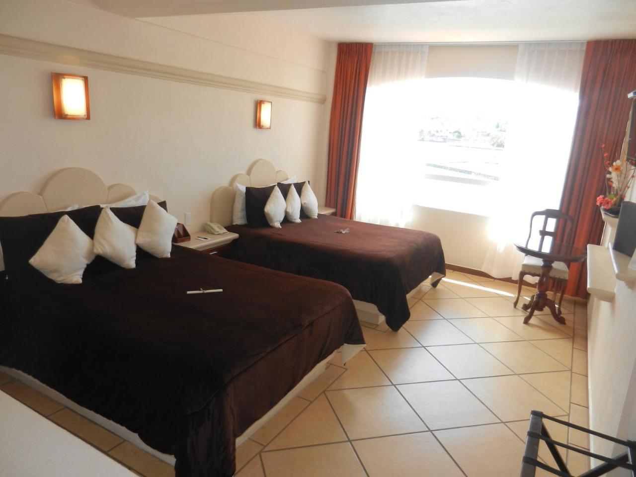 Hotel 9 Manantiales Чигнауапан Екстериор снимка
